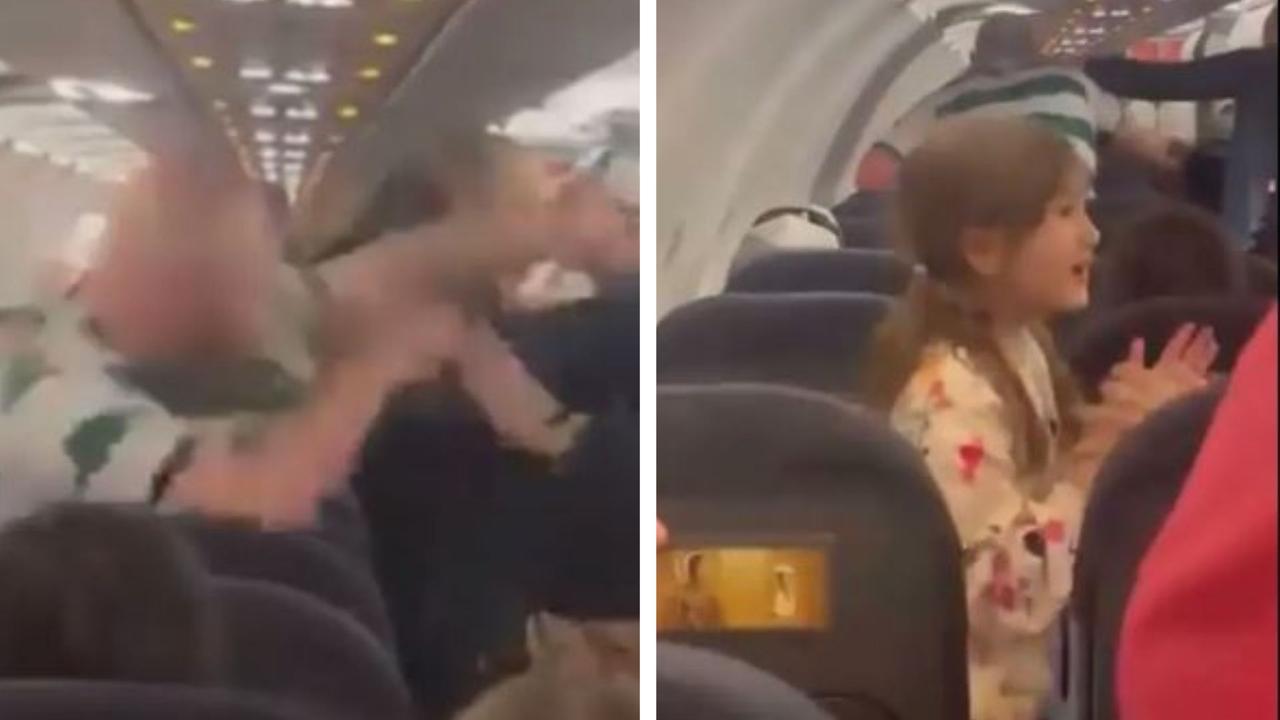 Little girl terrified amid plane brawl