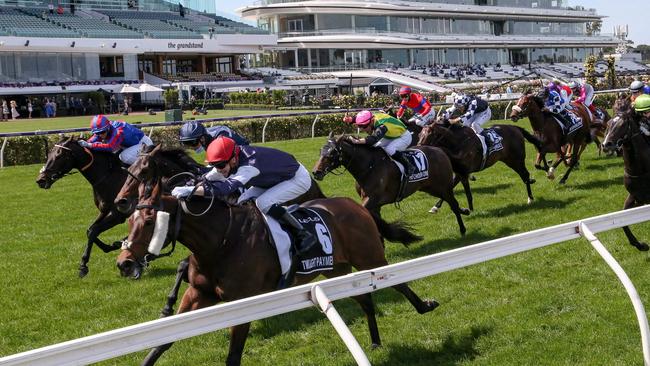 Twilight Payment and Jye McNeil combine to win the Melbourne Cup in front of empty grandstands at Flemington.