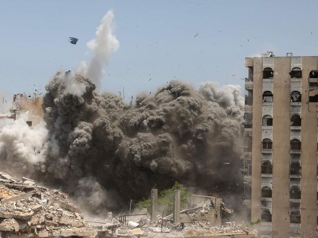 Smoke and debris rise following an Israeli strike on a house west of Jabalia, in the northern Gaza Strip, on June 1, 2025, amid the war between Israel and the Palestinian Hamas militant movement. (Photo by BASHAR TALEB / AFP)