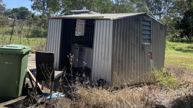 A Jubilee Pocket resident said he managed to throw gas bottles out of a shed in front of a house on fire in Shute Harbour Rd. Picture: Estelle Sanchez