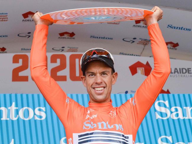 Australian rider Richie Porte from team Trek-Segafredo reacts on the podium after winning the Tour Down Under UCI World Tour cycling event in Adelaide on January 26, 2020. (Photo by Brenton EDWARDS / AFP) / -- IMAGE RESTRICTED TO EDITORIAL USE - STRICTLY NO COMMERCIAL USE --