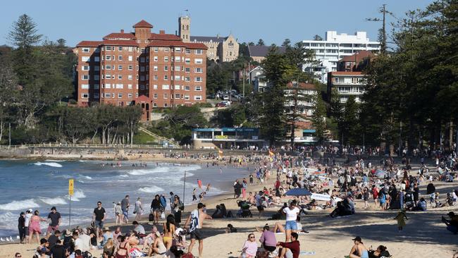 Crowds enjoying the unseasonably warm weather at Manly Beach in August 2020. Picture: Jonathan Ng