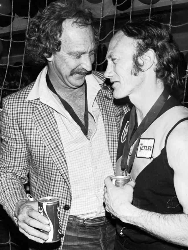 Tigers coach Tony Jewell celebrates with a Coke with Kevin Bartlett.