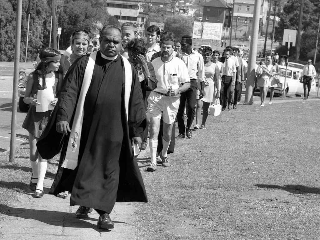 1970 - Pastor Don Brady leads about 60 people in a silent march along College Road, Spring Hill, to remember Aboriginal dead. Picture: Noel Pascoe