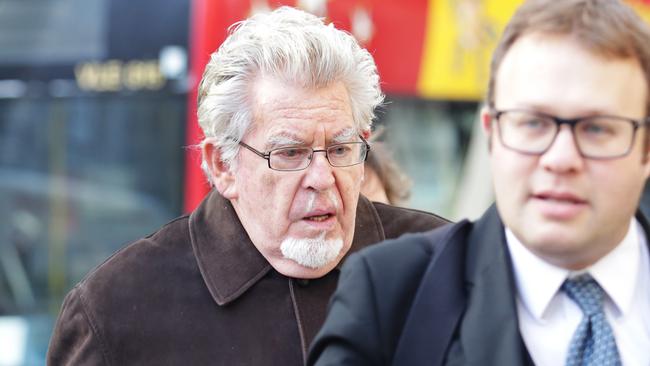 Rolf Harris arrives at the Royal Court of Justice in London with his solicitor Daniel Burke during his trial. Picture: Ella Pellegrini