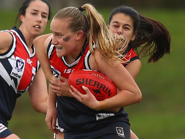 MELBOURNE, AUSTRALIA - JUNE 26: Victoria Blackwood of Darebin is tackled during the round 14 VFLW match between Darebin and Essendon at Bill Lawry Oval on June 26, 2021 in Melbourne, Australia. (Photo by Mike Owen/AFL Photos/via Getty Images)