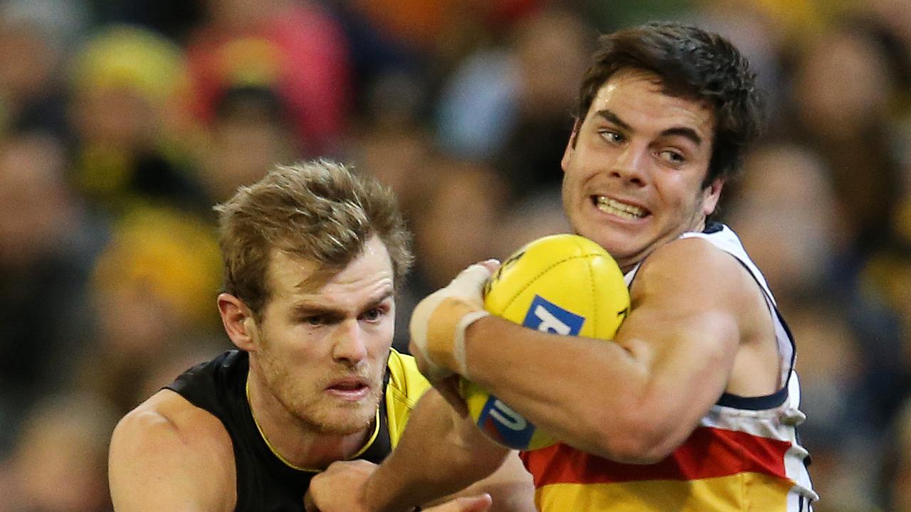 Adelaide's Darcy Fogarty tries to break the tackle of Richmond's David Astbury last year. He has been earmarked for a defensive role this season. Picture: Michael Klein