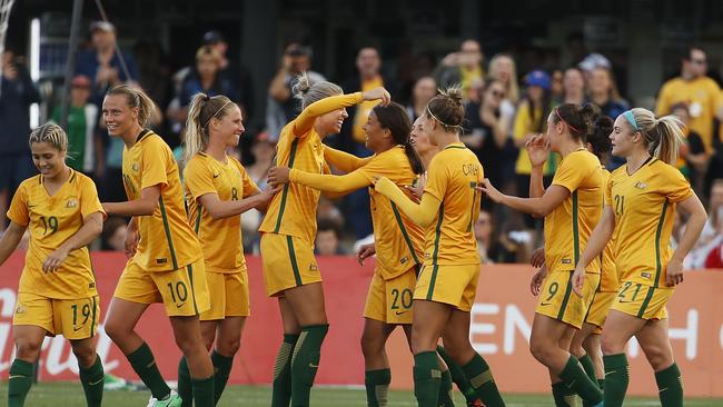 The Matildas celebrate their win over Brazil.