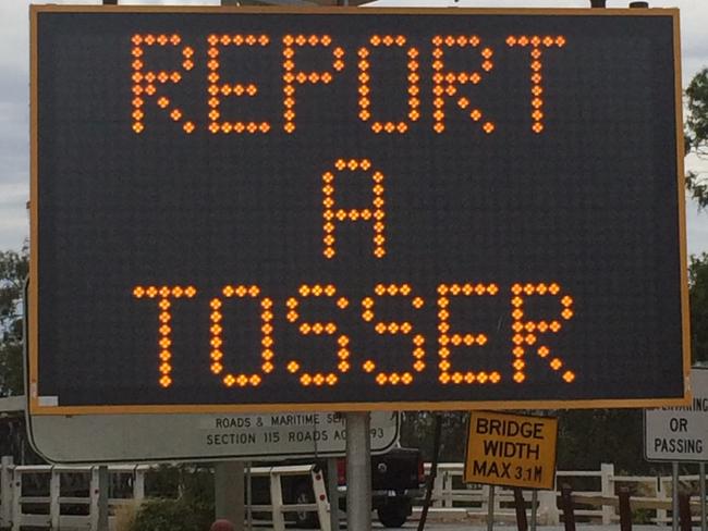 An EPA sign encouraging motorist’s to report a tosser.