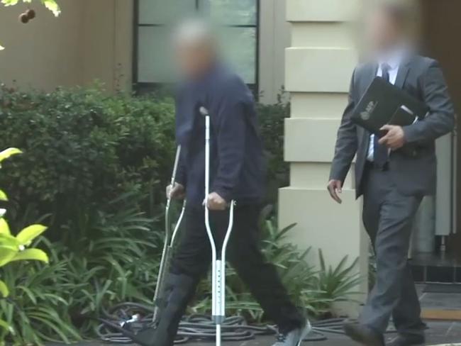 Zhen Tao Qi being led out of his Wahroonga home in September 2018 after his arrest. Picture: AFP