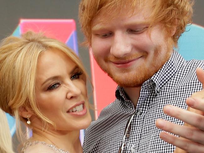 SYDNEY, AUSTRALIA - NOVEMBER 26: Kylie Minogue and Ed Sheeran dance on the red carpet ahead of the 29th Annual ARIA Awards 2015 at The Star on November 26, 2015 in Sydney, Australia. (Photo by Mark Metcalfe/Getty Images)