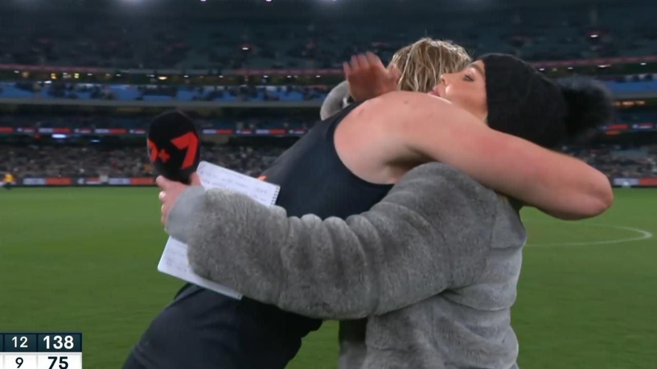 Abbey Holmes and TDK embrace post game