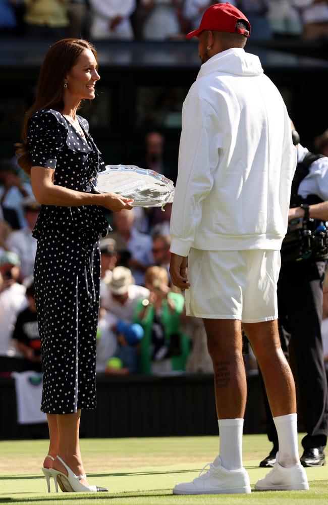 Nick Kyrgios receives the runner up trophy from Kate. Picture: Getty Images