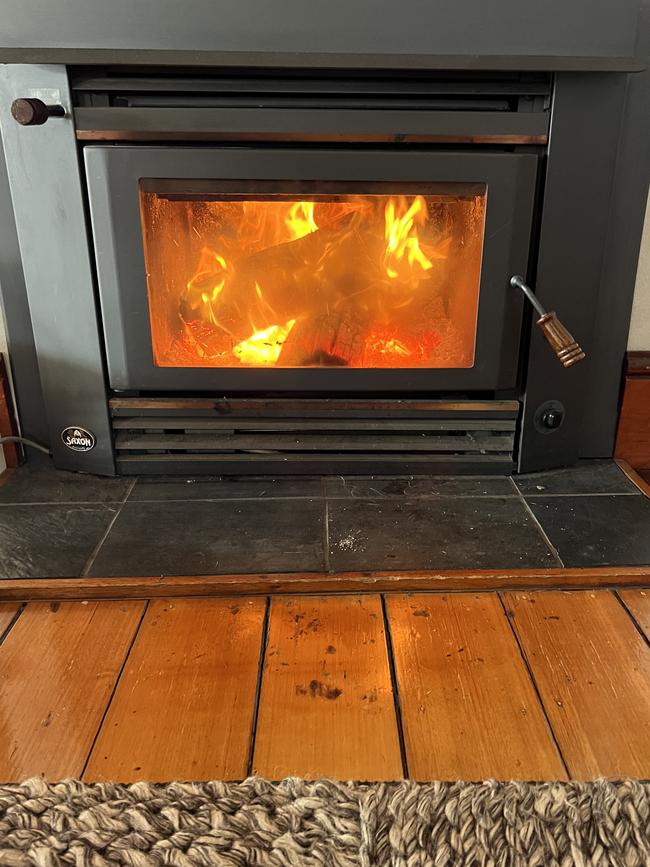 A slow combustion wood heater keeps things cosy at The Cape House, at Dover. Picture: Philip Young