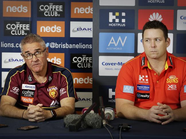 Stuart Dew and Chris Fagan chat to media as opposing coaches before a QClash. Picture: AAP/Megan Slade