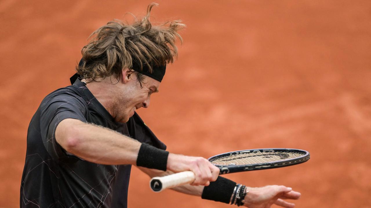 Racquet smash. (Photo by Bertrand GUAY / AFP)