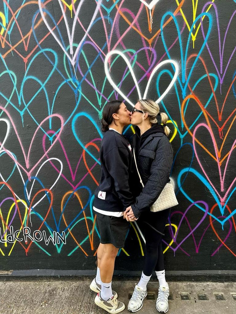 Kristie Mewis kisses Sam Kerr in a photo shared on Instagram.