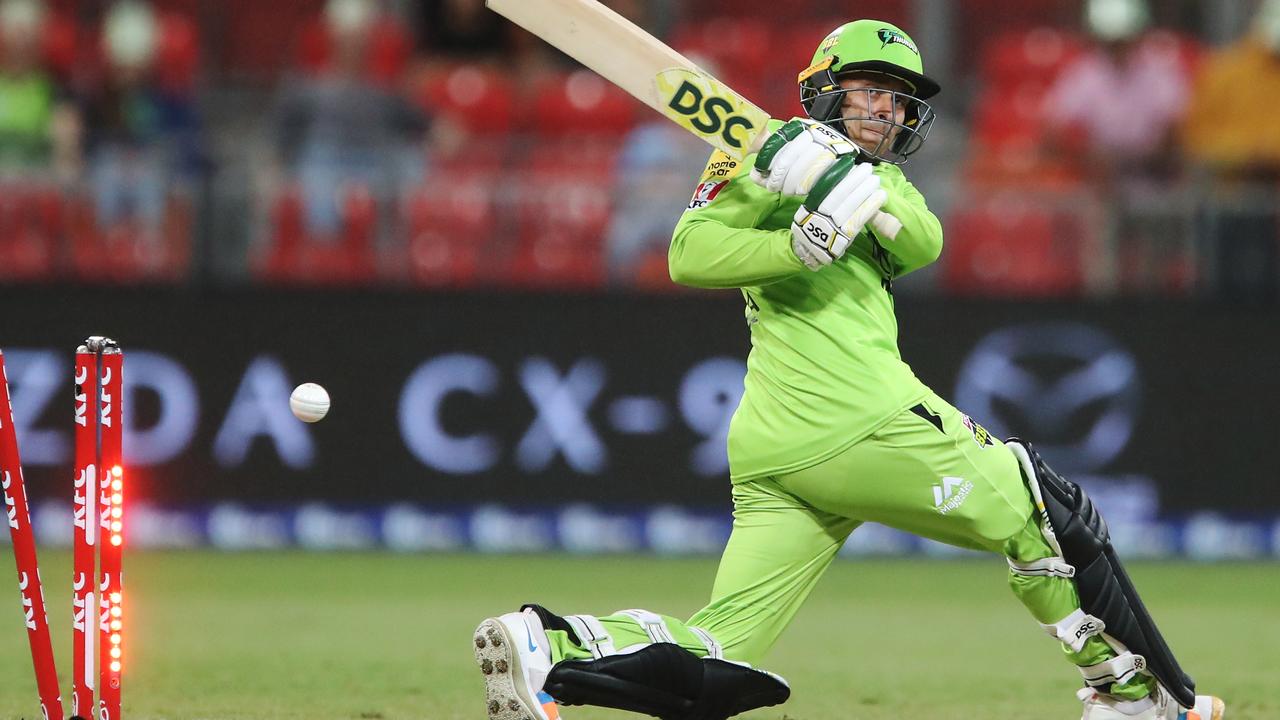 Usman Khawaja of the Thunder is bowled by Zahir Khan. Photo: AAP Image/Brendon Thorne