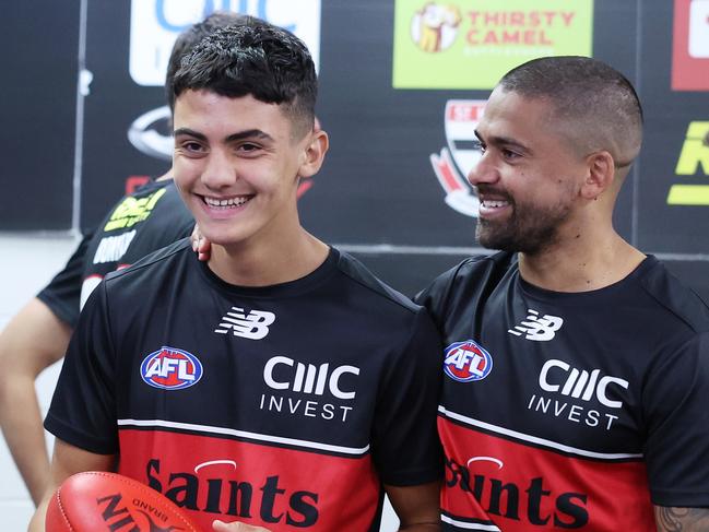 CANBERRA, AUSTRALIA - APRIL 13: Hugo Garcia of the Saints interacts with team mates before receiving his jumper on debut ahead of the round five AFL match between Greater Western Sydney Giants and St Kilda Saints at Manuka Oval, on April 13, 2024, in Canberra, Australia. (Photo by Mark Metcalfe/AFL Photos/Getty Images)