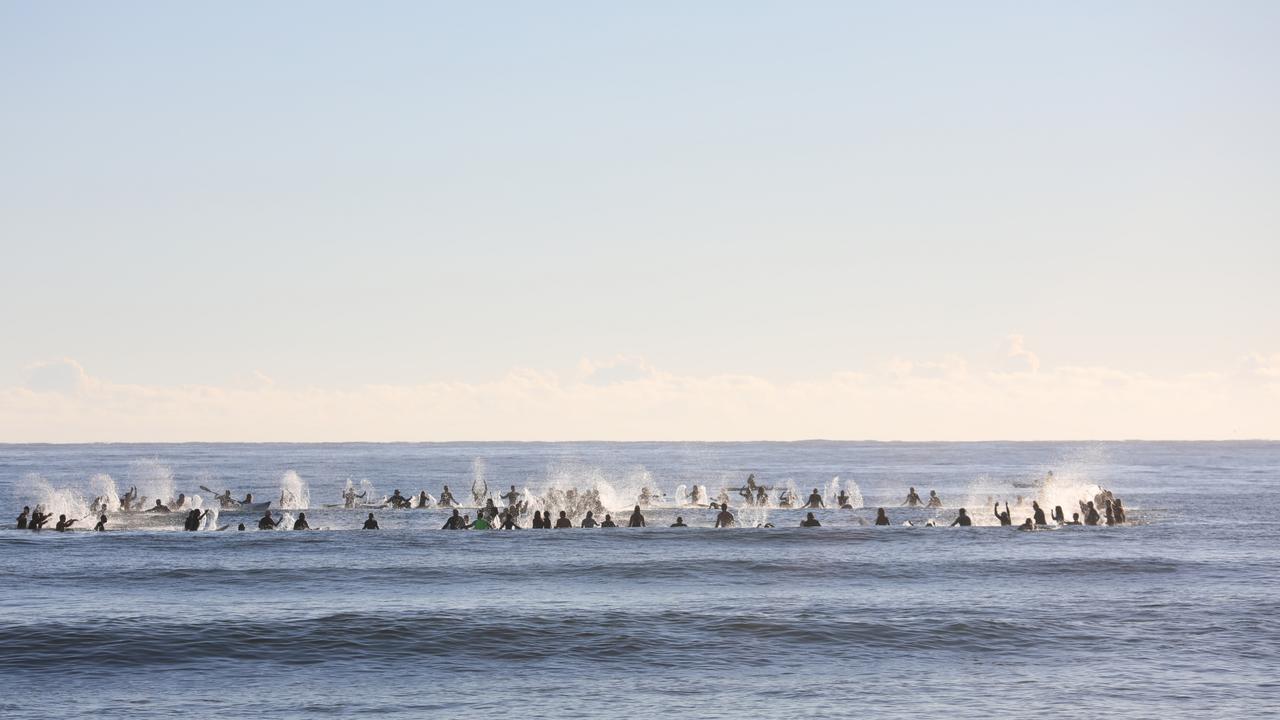 Members of the public took part in a paddle-out at Byron Bay's Main Beach to protest against the planned Netflix reality show Byron Baes on the morning of Tuesday, April 20, 2021. Picture: Liana Boss