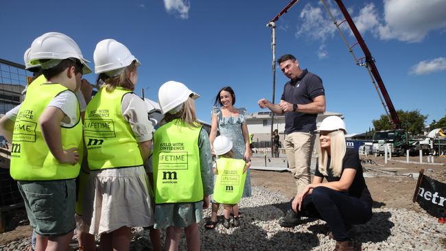 The family pictured at the site of their new home when the foundation was laid. Picture: Glenn Hampson.