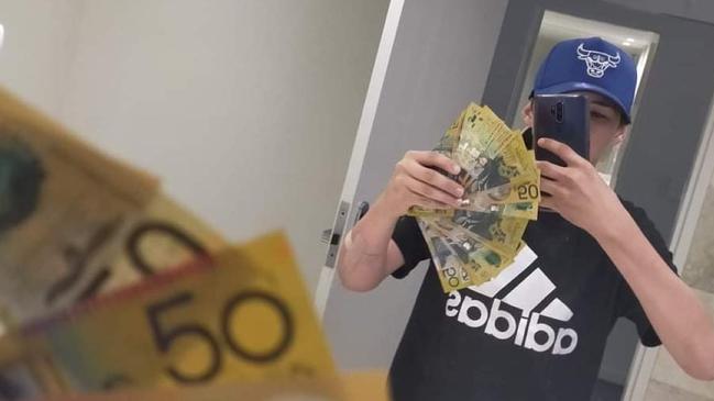 Cairns teen Bradley Smith poses with wads of cash. Picture: Facebook