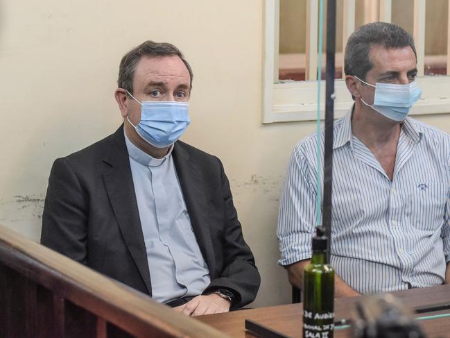 Argentine retired Bishop Gustavo Oscar Zanchetta (L) appears in court in Oran, Argentina on March 4, 2022. - Zanchetta, considered close to Pope Francis, was sentenced Friday to four years and six months in prison for sexual abuse of two seminarians by a court in the northwestern city of Oran, which ordered his immediate arrest, according to the ruling. (Photo by Gaston INDA / AFP)