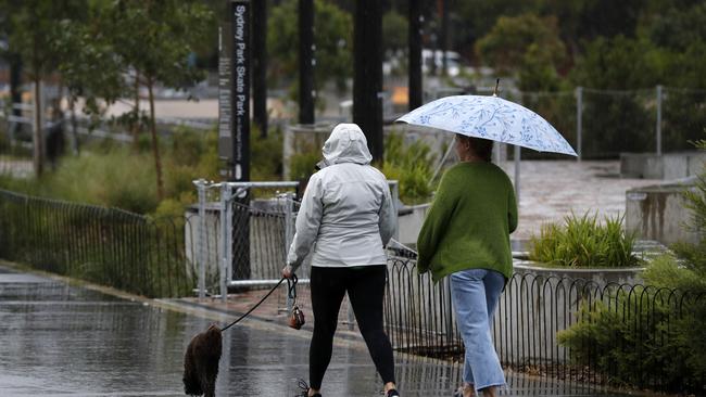 Wild weather is expected to continue across eastern Australia throughout Friday before easing into the weekend, tipped to bring torrential rain and the chance of flash flooding across much of NSW. Picture: Jonathan Ng