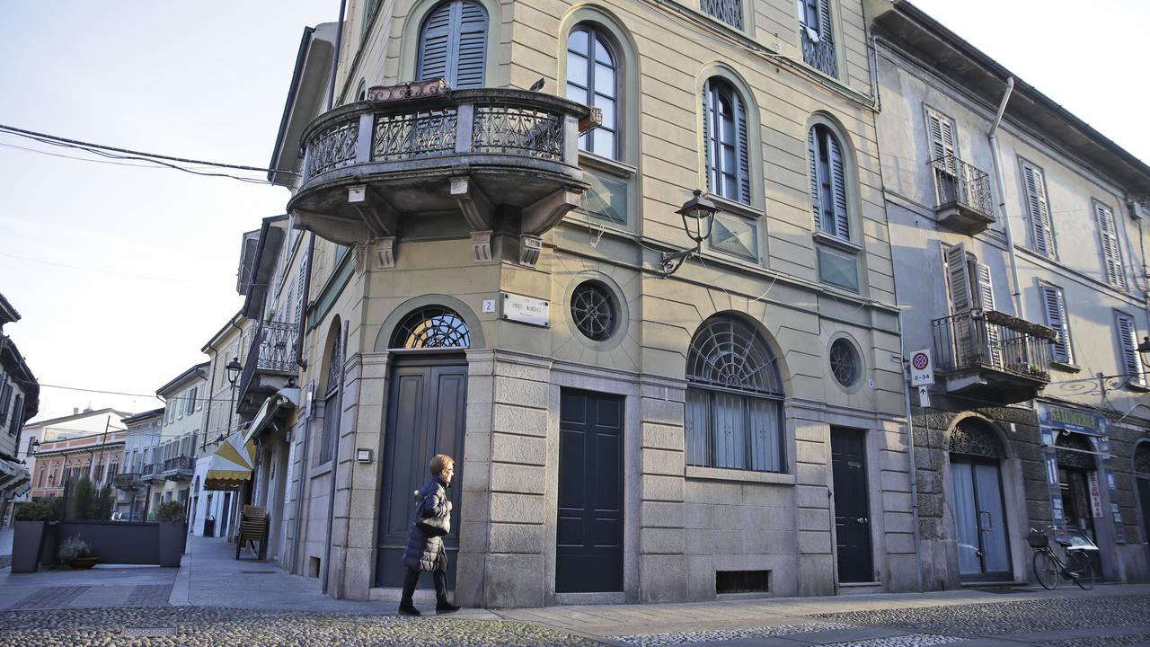 A woman walks in a street in the centre of Codogno, Italy on Friday, February 21, 2020. Codogno is one of the hospitals hosting the infected. Picture: Luca Bruno/AP