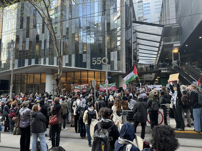 Protesters continue their rally outside Hanwha’s office on Bourke St. Picture: Herald Sun