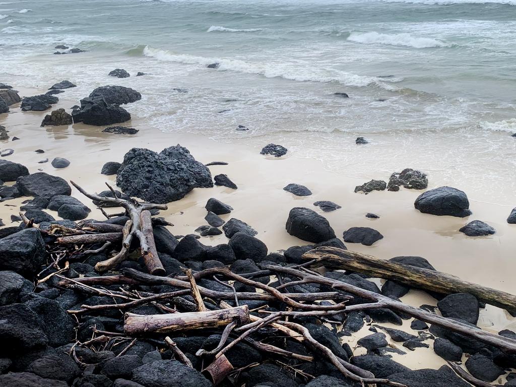 Large amounts of drift wood and debris is now littering Gold Coast beaches after flooding from torrential rain has caused creeks and rivers to break their banks. NCA NewsWire / Scott Powick