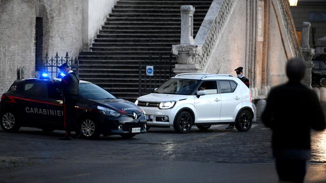 Carabinieri military police patrol in central Rome amid the Covid-19 pandemic. Italy has shut bars, restaurants and shops in the worst-affected areas and introduced a 10pm-5am nationwide curfew.