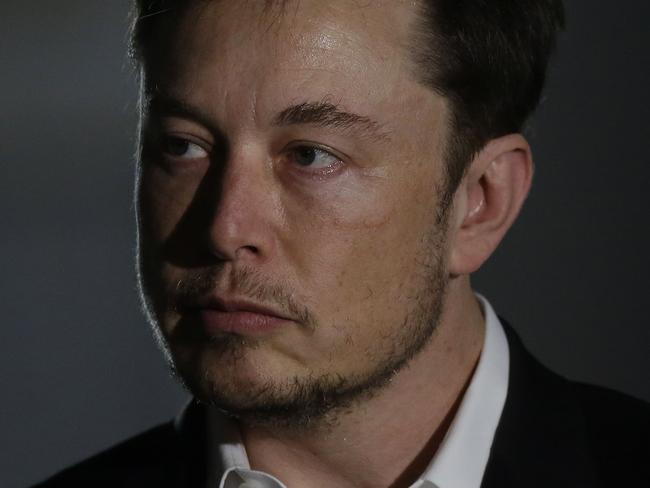 CHICAGO, IL - JUNE 14: Engineer and tech entrepreneur Elon Musk of The Boring Company listens as Chicago Mayor Rahm Emanuel talks about constructing a high speed transit tunnel at Block 37 during a news conference on June 14, 2018 in Chicago, Illinois. Musk said he could create a 16-passenger vehicle to operate on a high-speed rail system that could get travelers to and from downtown Chicago and O'hare International Airport under twenty minutes, at speeds of over 100 miles per hour.   Joshua Lott/Getty Images/AFP == FOR NEWSPAPERS, INTERNET, TELCOS & TELEVISION USE ONLY ==
