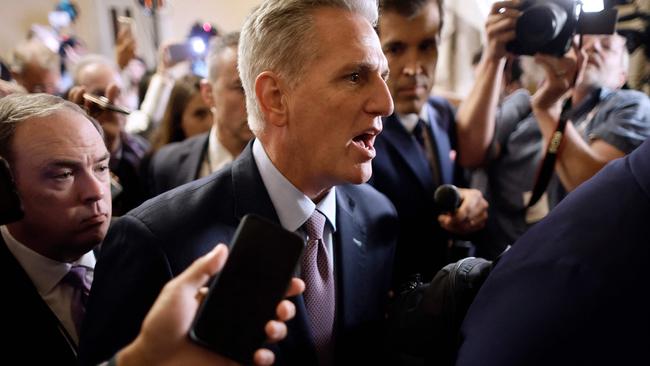 WASHINGTON, DC - OCTOBER 03: Speaker of the House Kevin McCarthy (R-CA) is surrounded by staff, security and journalists as he walks to the House Chamber ahead of a vote at the U.S. Capitol on October 03, 2023 in Washington, DC. McCarthy's speakership is being challenged by a handful of conservative members of his own party lead by Rep. Matt Gaetz (R-FL) following a deal to keep the federal government from partially shutting down over the weekend.   Chip Somodevilla/Getty Images/AFP (Photo by CHIP SOMODEVILLA / GETTY IMAGES NORTH AMERICA / Getty Images via AFP)