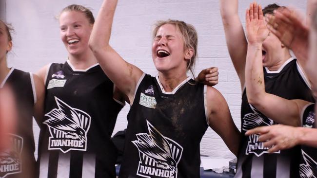 Hannah Slaughter, who is heading back to Cambodia, belts out the club song with her Ivies teammates Picture: Alistair Knox