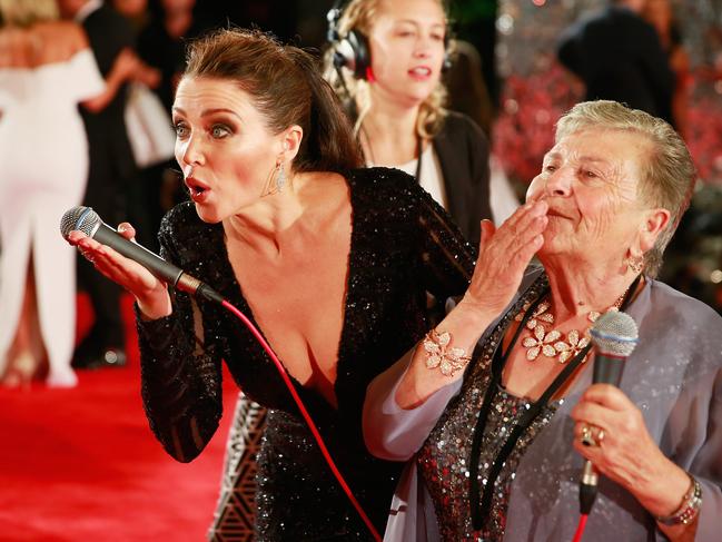 Dannii Minogue blows a kiss to the cameras with Nonna Paola as she arrives at the 57th Annual Logie Awards at Crown Palladium. Picture: Getty