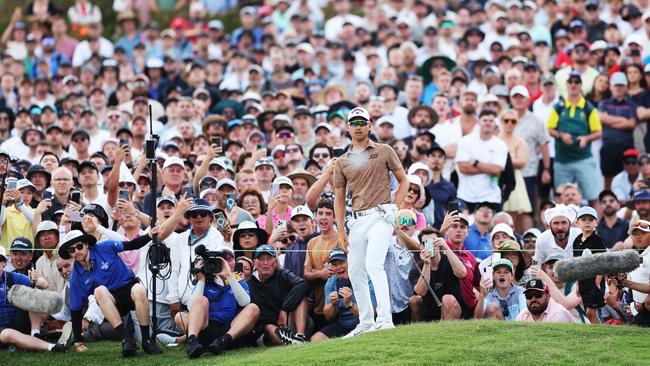 Min Woo Lee of Australia plays a shot on the 18th hole during the Australian Open. Picture: Mark Metcalfe/Getty Images.