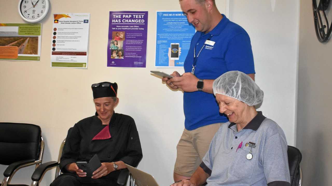 WI-FI SMILES: Toni Cant, Stuart Batterham and Linda Schefe use free Wi-Fi, now at hospitals and health facilities in the southwest. Picture: Ellen Ransley