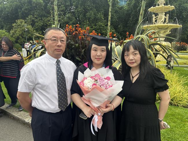 Xie Si Qiuo with family at the University of Melbourne's Faculty of Architecture, Building and Planning graduation ceremony at the Royal Exhibition Building on December 6, 2024. Picture: Harvey Constable