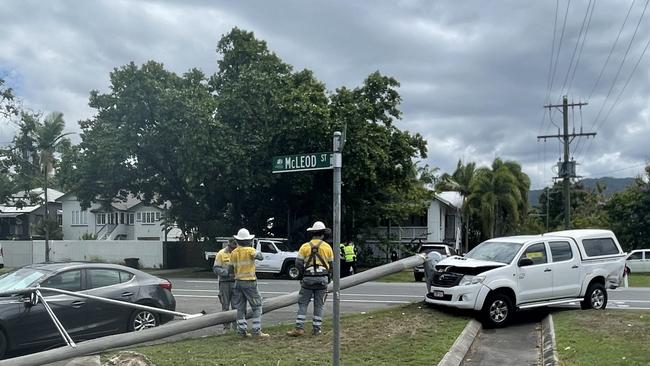 Emergency services including firefighters, police and paramedics and Ergon Energy workers attended a two vehicle crash which involved one car also hitting a street pole in North Cairns on November 9, 2022. Picture: Alison Paterson