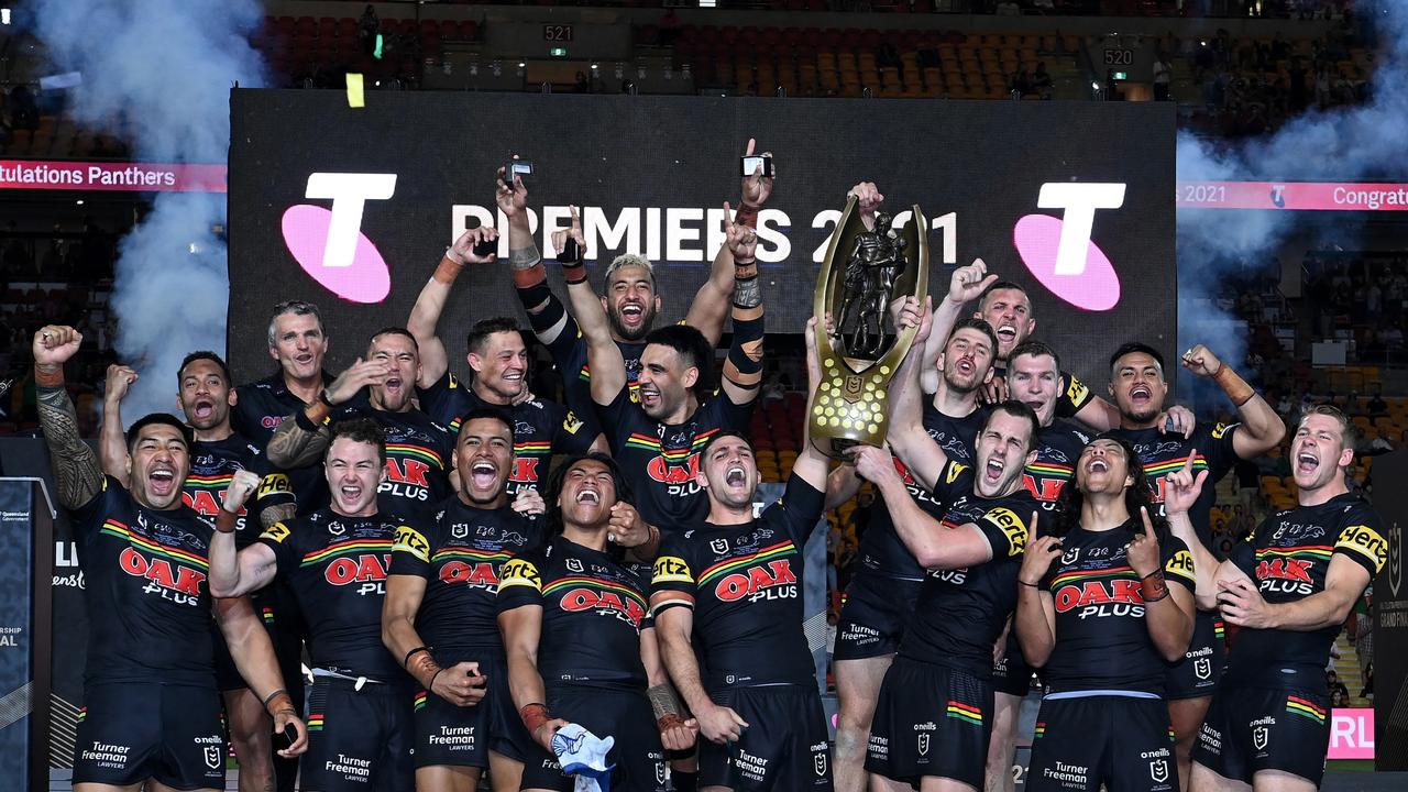 BRISBANE, AUSTRALIA – OCTOBER 03: The Panthers celebrate with the Premiership Trophy after winning the 2021 NRL Grand Final match between the Penrith Panthers and the South Sydney Rabbitohs at Suncorp Stadium on October 03, 2021, in Brisbane, Australia. (Photo by Bradley Kanaris/Getty Images)