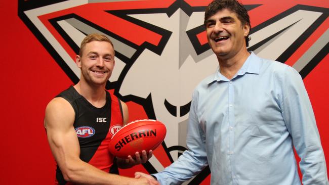 Devon Smith joined Essendon and was welcomed by Bombers list manager Adrian Dodoro.