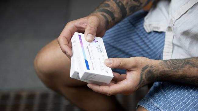 A customer holds his rapid antigen tests (RAT) after purchasing them from a chemist in Sydney. Picture: NCA NewsWire / Nikki Short