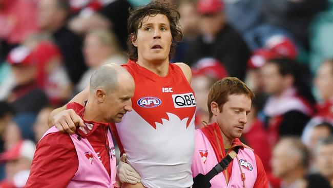 Kurt Tippett is helped off the pitch by medical staff during the Round 23 match in 2017. Picture: AAP