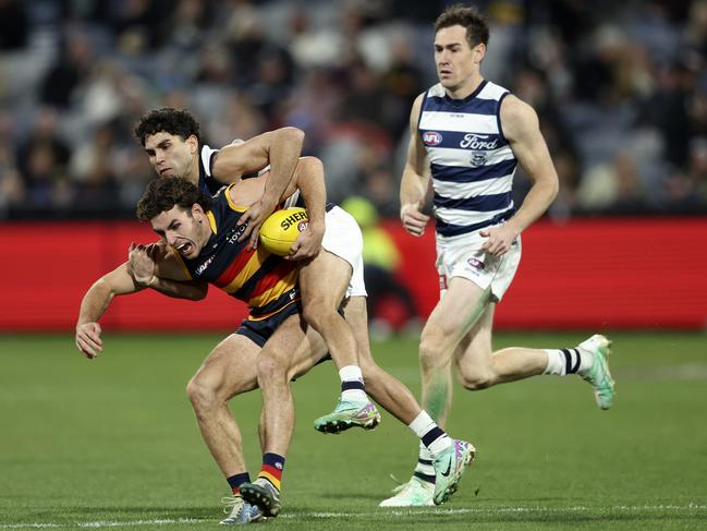 Tyson Stengle tackles Crow Hugh Bond. Picture” Martin Keep/AFL Photos/via Getty Images)