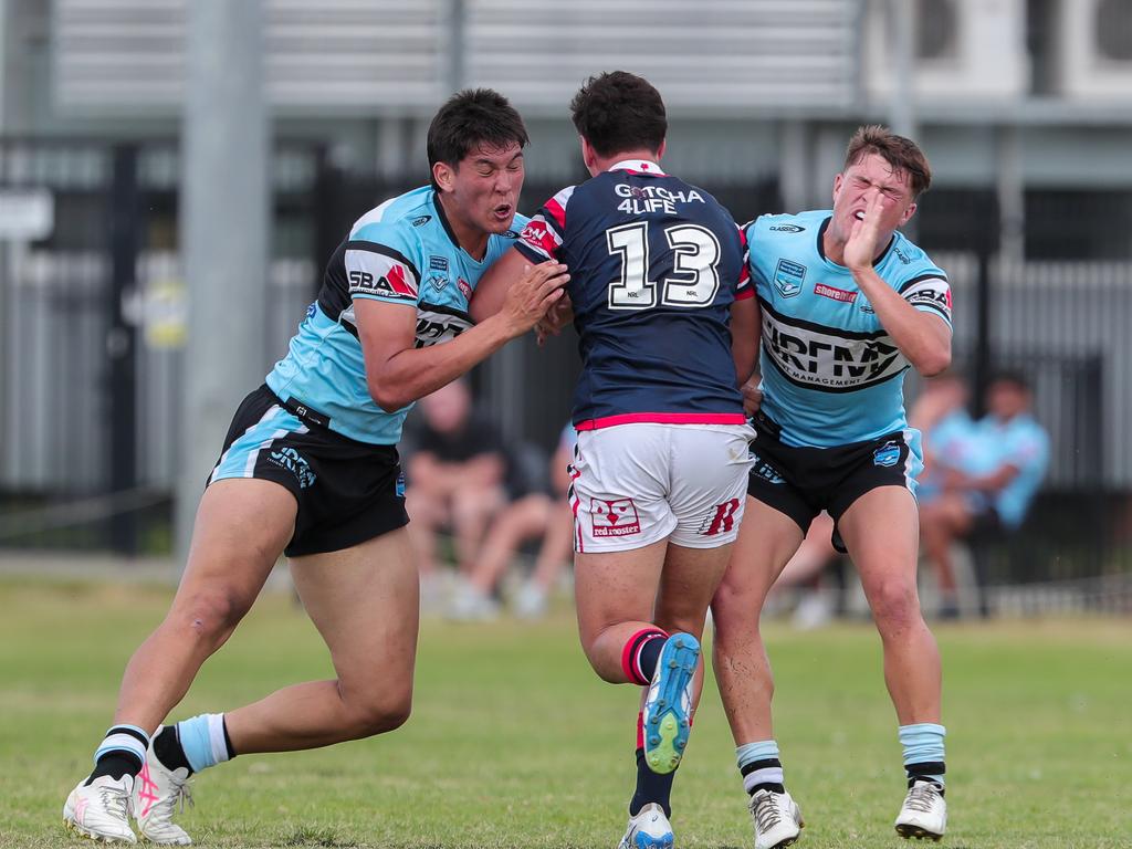 Marquis Sando running into Sidney Truong &amp; Tobi Beckett. Picture: Adam Wrightson Photography