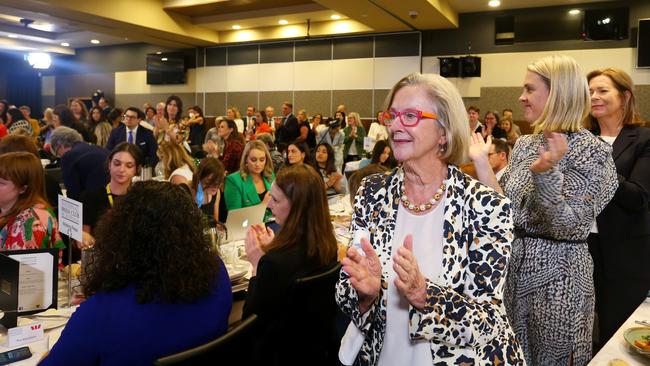 Guests rise from their seats following a speech from Grace Tame and Brittany Higgins at the National Press Club. Picture: Lisa Maree Williams/Getty Images