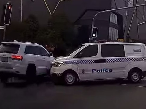 Dashcam footage has captured the nailbiting moment a car was inches away from colliding with a police vehicle on the Gold Coast. Picture: Facebook