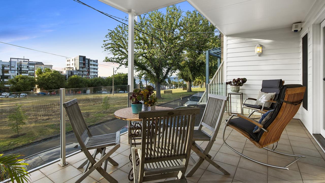 The first floor balcony overlooks Austin Park and the waterfront.