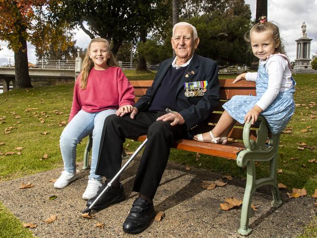 23/04/2021 Kevin Harper, 89, pictured with great-grandkids (L-R) Jordyn Adams (10) and Charlee Adams (4), is one of the last survivors of the Battle of Kapyong in Korea in 1951, fought over the Anzac Day weekend. He will march in Benalla on Sunday with his grandchildren and children who are descending on the town for the day.  Aaron Francis/The Australian